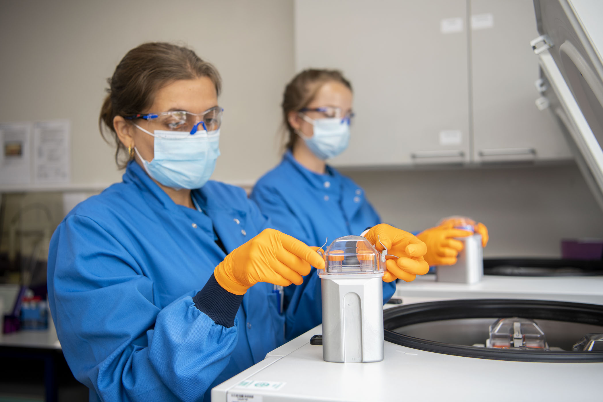 BioResource staff using Centrifuge machine for samples.