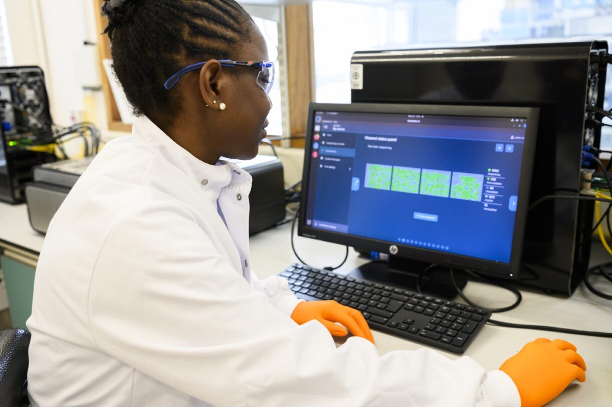 One of our laboratory technicians, Alimat assessing the efficiency of pore utilization of the flow cells being sequenced on the PromethIONs