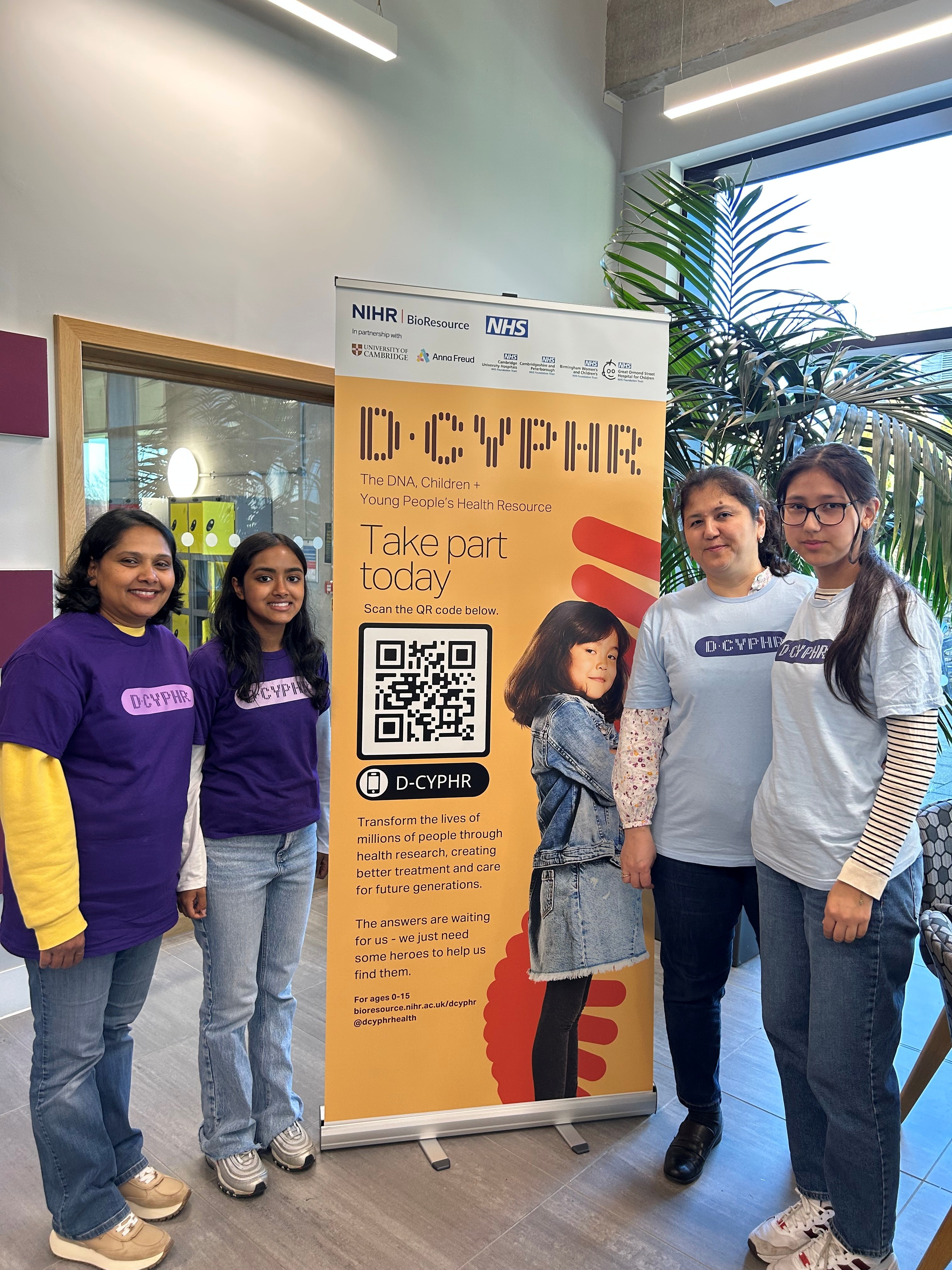 D-CYPHR Ambassadors at event standing by roller banner