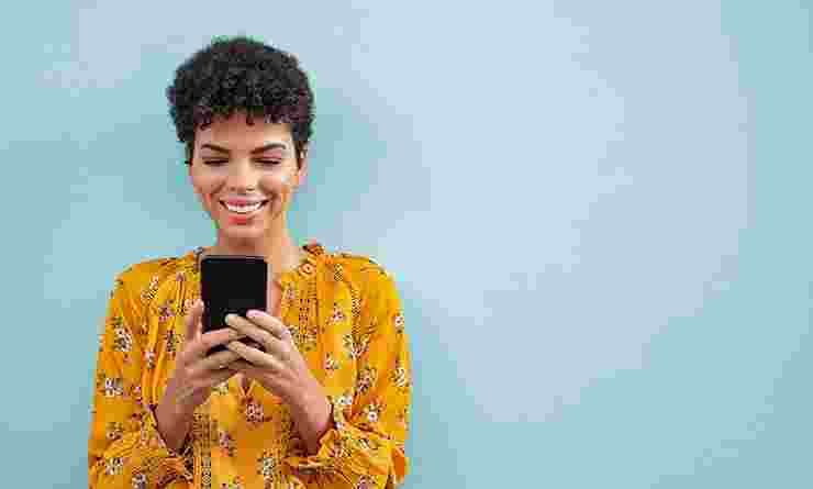 Woman looks at smart phone