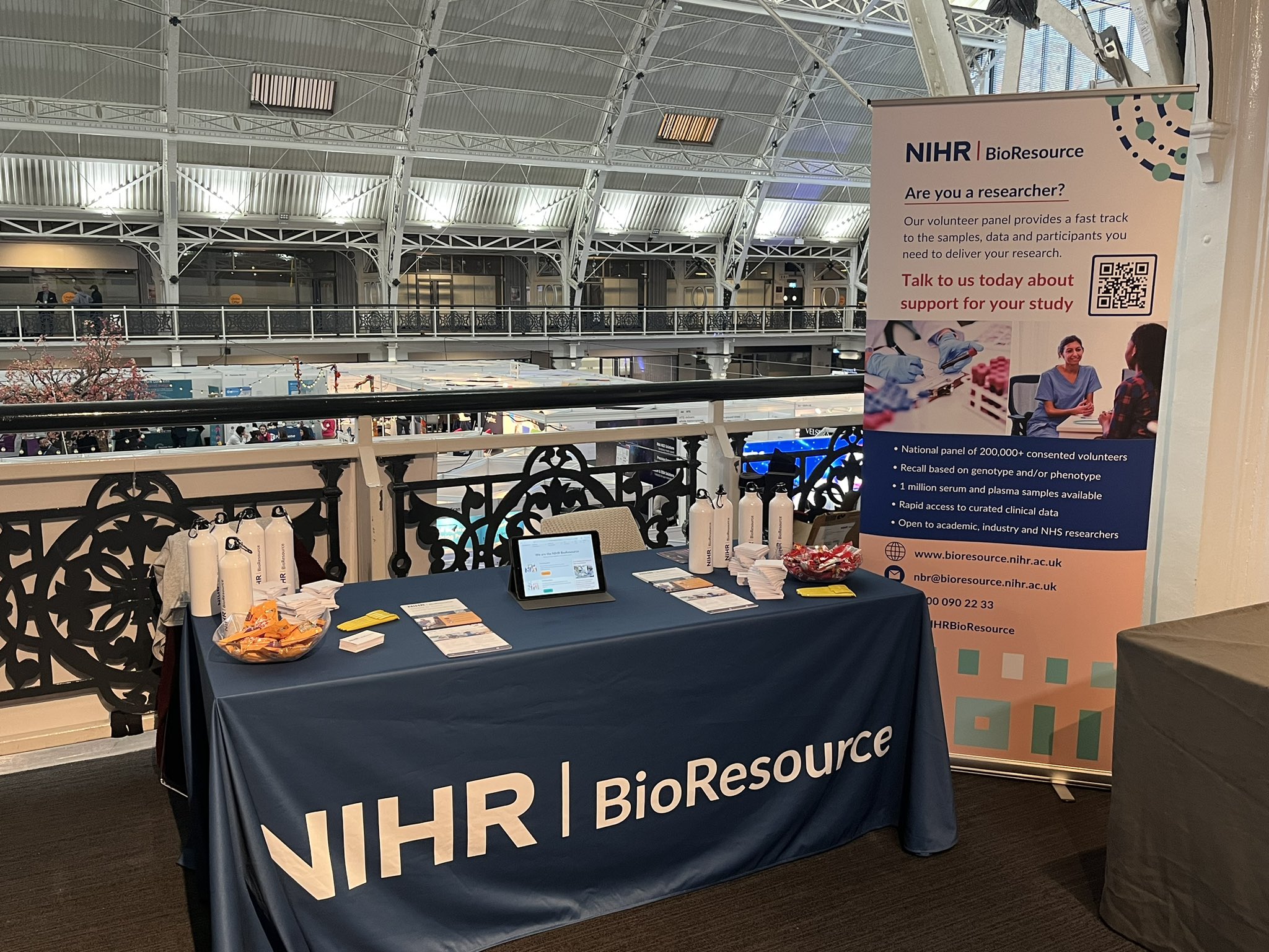 BioResoure exhibition table with promotional materials and banner on the mezzanine at Festival of Genomics